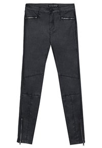 Svarta tights av denim med dragkedjor på fickorna och dragkedjeaccenter vid anklarna. Har en jämn textur och en figursydd design.