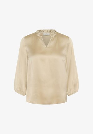 Beige satin blouse with three-quarter sleeves, ruffled neckline, and a V-shaped opening. Smooth texture with a simple, elegant design.