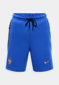 Blauwe sportshorts met een zwarte trekkoord, een ritsvak aan de zijkant, een gouden voetbal logo van Frankrijk op het linkerbeen en een gouden Nike Swoosh op het rechterbeen.