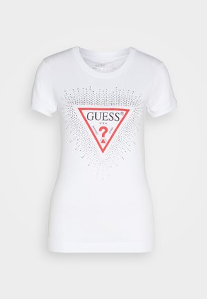 Fehér pamut póló, piros háromszög logóval, rajta "GUESS U.S.A." felirattal, ragyogó pöttyökkel, amelyek körbe sugároznak, rövid ujjal és kerek nyakkivágással.