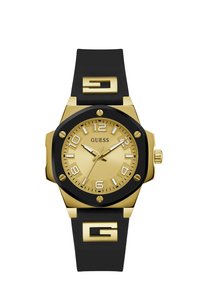 Goldfarbene Uhr mit einem schwarzen Silikonarmband. Sie verfügt über große, klare Ziffern, ein strukturiertes goldfarbenes Zifferblatt und ein markantes "G"-Logo am Band.