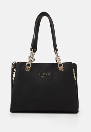Musta tekstuuriga nahast Guess käekott kaheteistkümne sangaga, kuldse tooni seadmed, logo charm ja esiküljel bränditud plaat, millel on külgedel tõmblukkude detailid.
