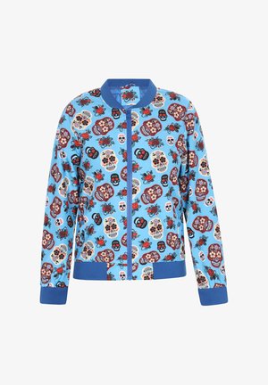 Jachetă bomber albastră cu un model colorat de cranii și flori, având fermoar frontal, guler și mansete ribbate.
