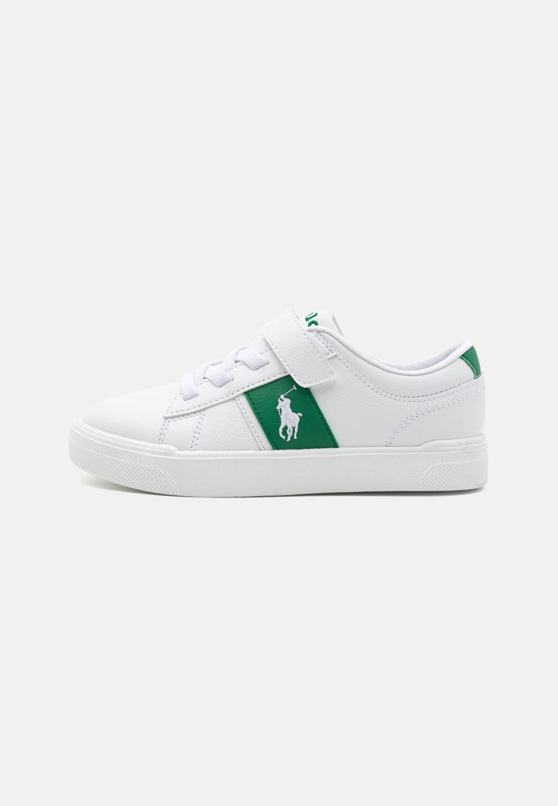 White sneakers made of synthetic material featuring a green lateral stripe, a hook-and-loop strap, and a textured rubber sole.