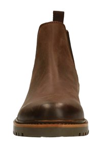 Bruine leren chelsea boot met ronde neus, elastische zijpanelen en stevige rubberen zool. Fijne textuur met subtiele stikseldetails.