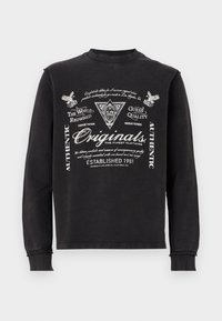 Sort sweatshirt lavet af blødt stof med lange ærmer. Har teksturerede hvide grafikker og tekst foran. Rund halsudskæring, afslappet pasform.