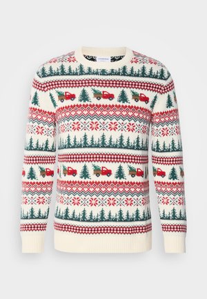 Maglione lavorato a maglia con base crema, motivi rossi e verdi di alberi, camion e fiocchi di neve, con polsini e orlo a costine.