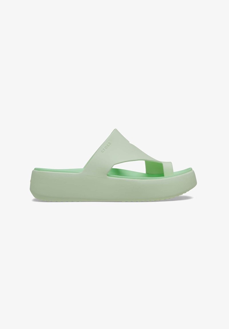 Light green rubber slide sandal with an open-toe design, wide cross-strap, and a thick cushioned sole. Features brand logo embossed on the side.