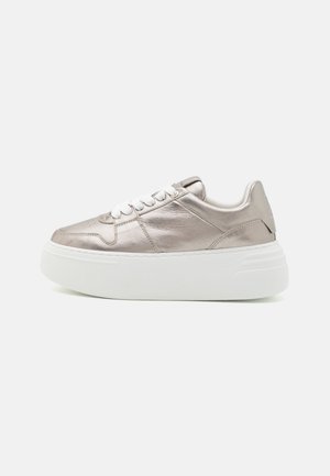 Silver low-top sneaker with white thick platform sole and white laces, shown in side profile on a plain background.