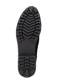 Suela de zapato de goma negra con un patrón de tracción en zigzag, superficie texturizada y estrías elevadas para agarre y tracción.