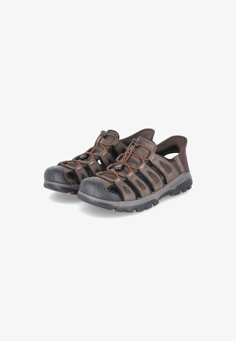 Brown outdoor sandals featuring breathable mesh panels, elastic laces, rubber toe caps, and textured soles with orange accents.