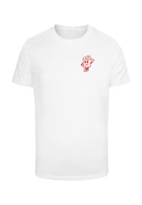 T-shirt en coton blanc avec un petit graphisme de personnage de dessin animé rouge sur le côté gauche de la poitrine, encolure arrondie et manches courtes.