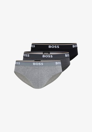 Tre paia di slip da uomo in grigio, grigio scuro e nero, con cintura elasticizzata e logo "BOSS" bianco, caratterizzati da una texture liscia.