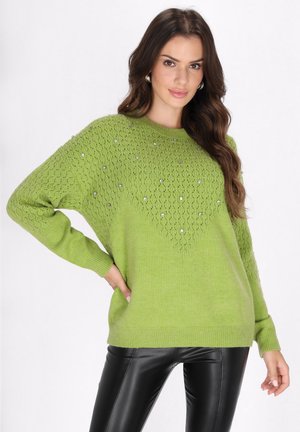 Pulover verde din tricot cu un design texturat, în model de diamant și accesorii. Mâneci lungi, croială lejeră și manșete cu nervuri.