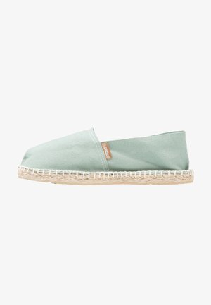 Light green canvas espadrille with elastic side panels and braided jute sole, featuring stitched detailing along the sole edge.