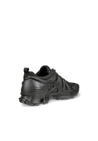 Black athletic shoe featuring a textured synthetic upper, mesh panels, rubber sole, and pronounced tread for traction. Minimalist design.