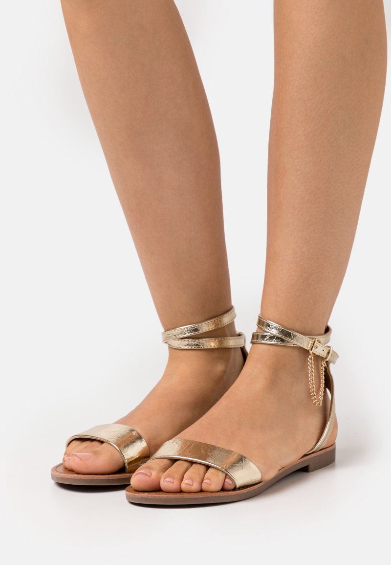 ONLY SHOES Varrelliset sandaalit - gold-coloured