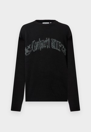 Zwarte trui met lange mouwen en ronde hals, met vervaagde grijze gotische "Carhartt WIP" tekst die over de borst is gebogen.