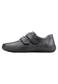 Black leather shoe with two adjustable Velcro straps, rounded toe, and sturdy rubber sole. Smooth texture with subtle stitching detail.