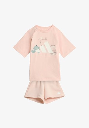 Child's light pink short-sleeve shirt and matching shorts set with playful animal graphics and white Adidas logo on both pieces.