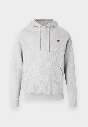 Grauer gerippter Hoodie mit verstellbaren Kordeln, Seitentaschen und einem kleinen schwarzen Logo auf der Brust. Weicher, strukturierter Stoff.