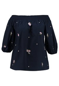 Blouse bleu marine à épaules dénudées avec un col et des manches élastiques, ornée de petites broderies florales roses dispersées sur le tissu.