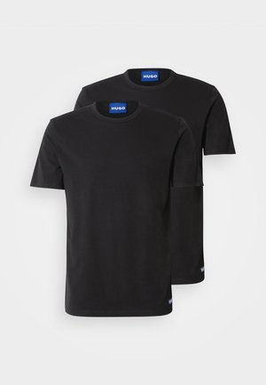 Two black cotton T-shirts with round necklines, short sleeves, and blue "HUGO" labels on the collars and side hems.