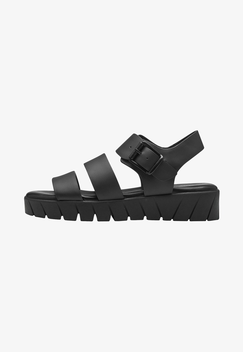 Black sandal with three wide straps and a side buckle. Features a thick, ridged sole with a textured pattern for grip and support.