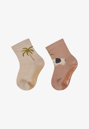 Two pairs of short socks: one beige with a palm tree design, the other light pink featuring a cow. Soft texture with ribbed cuffs.