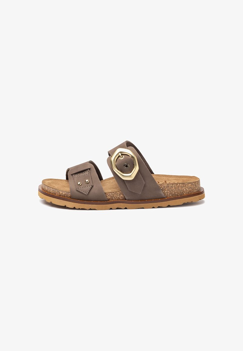 Brown leather slide sandal featuring two wide straps, a large gold-colored hardware detail, and a textured cork footbed on a rubber sole.