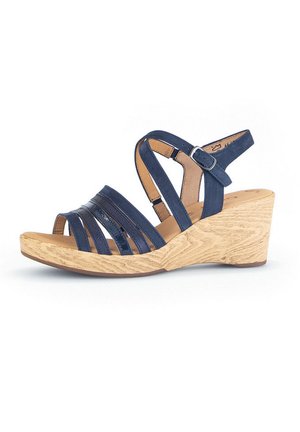 Navy blue leather wedge sandal with crisscross straps and a textured light brown wooden base. Features an adjustable ankle strap.