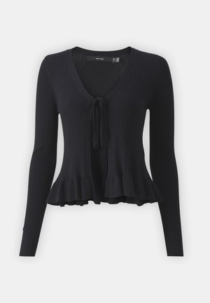 Cardigan noir à côtes avec un col en V, des manches longues, une fermeture devant à nouer, et un bas évasé. Fabriqué en matériau tricoté extensible.