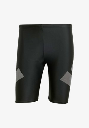 Zwarte zwembroek gemaakt van glad, rekbaar materiaal. Kenmerkt zich door diagonale witte strepen aan de onderzijden. Strakke pasvorm met een lengte tot halverwege de dij.