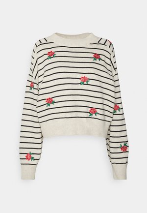 Crèmekleurige gestreepte gebreide trui met zwarte lijnen en rode bloemenborduursels. Verkorte pasvorm, lange mouwen en geribbelde halslijn en boorden.