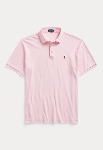 Light pink short-sleeve polo shirt with two buttons and a small embroidered horse and rider logo on the left chest.