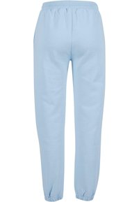 Ljust blå joggerbyxor i mjukt tyg med elastisk midja och smalnade mudd. Har en minimal design som ökar komfort och passform.