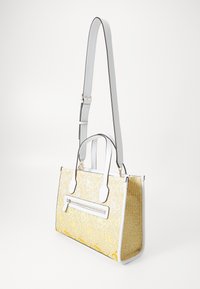 White handbag with a textured yellow woven body, featuring a top zipper and flat handles, accented by white edges and straps.