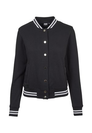 Black varsity jacket with ribbed collar and cuffs, snap-button closure, and white striped accents at the waist and sleeves. Soft fabric texture.