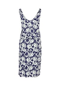 Robe sans manches mi-longue au genou avec un fond bleu marine et un motif floral blanc, présentant un décolleté en V et une taille froncée.