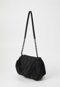 Black quilted shoulder bag with a soft texture, featuring a combination of fabric and chain strap, designed in a rectangular shape.