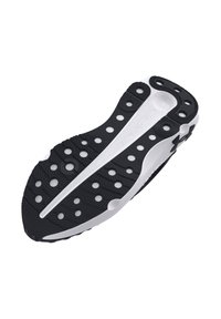 Zwart-witte rubberen zool met een gematteerd oppervlak, voorzien van cirkelvormige uitsparingen en verschillende patronen voor grip en flexibiliteit.