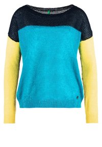 Färgstblocked tröja med svart, turkos och gult mönster, tillverkad av mjukt tyg med avslappnad passform och vid halsringning.
