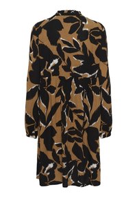 Robe marron à manches longues avec de grands motifs de feuilles noires et blanches, vue de dos.