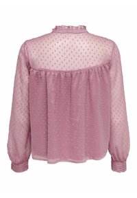 Blouse rose transparent avec un motif à pois texturé, col volanté et manches longues avec poignets froncés. Conception légère et fluide.