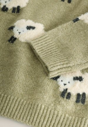 Neulepaita oliivinvihreänä, jossa on kermansävyisiä ja mustia pörröisiä lammaskuvioita. Vyötärössä resorit, joissa pehmeä pinta.