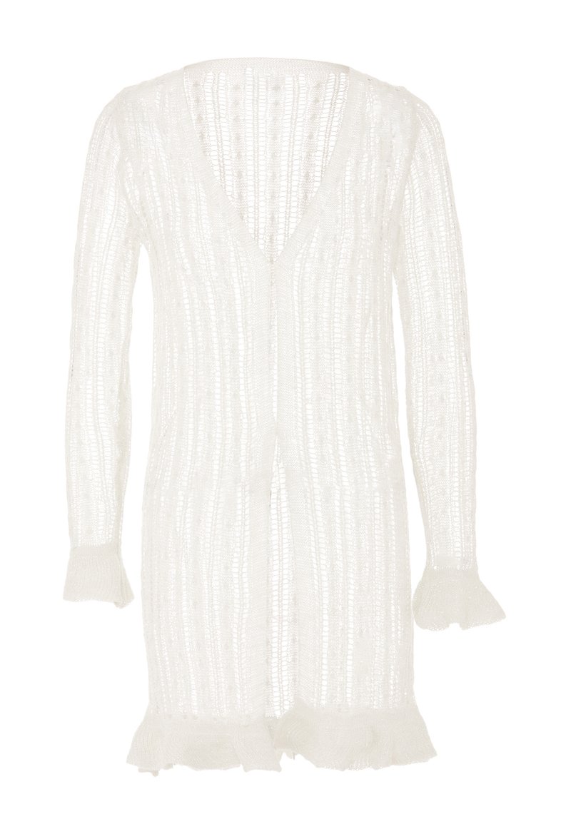 Cárdigan blanco con escote en V, silueta alargada, textura acanalada y puños acampanados con bordes frisados. Diseño ligero y abierto.