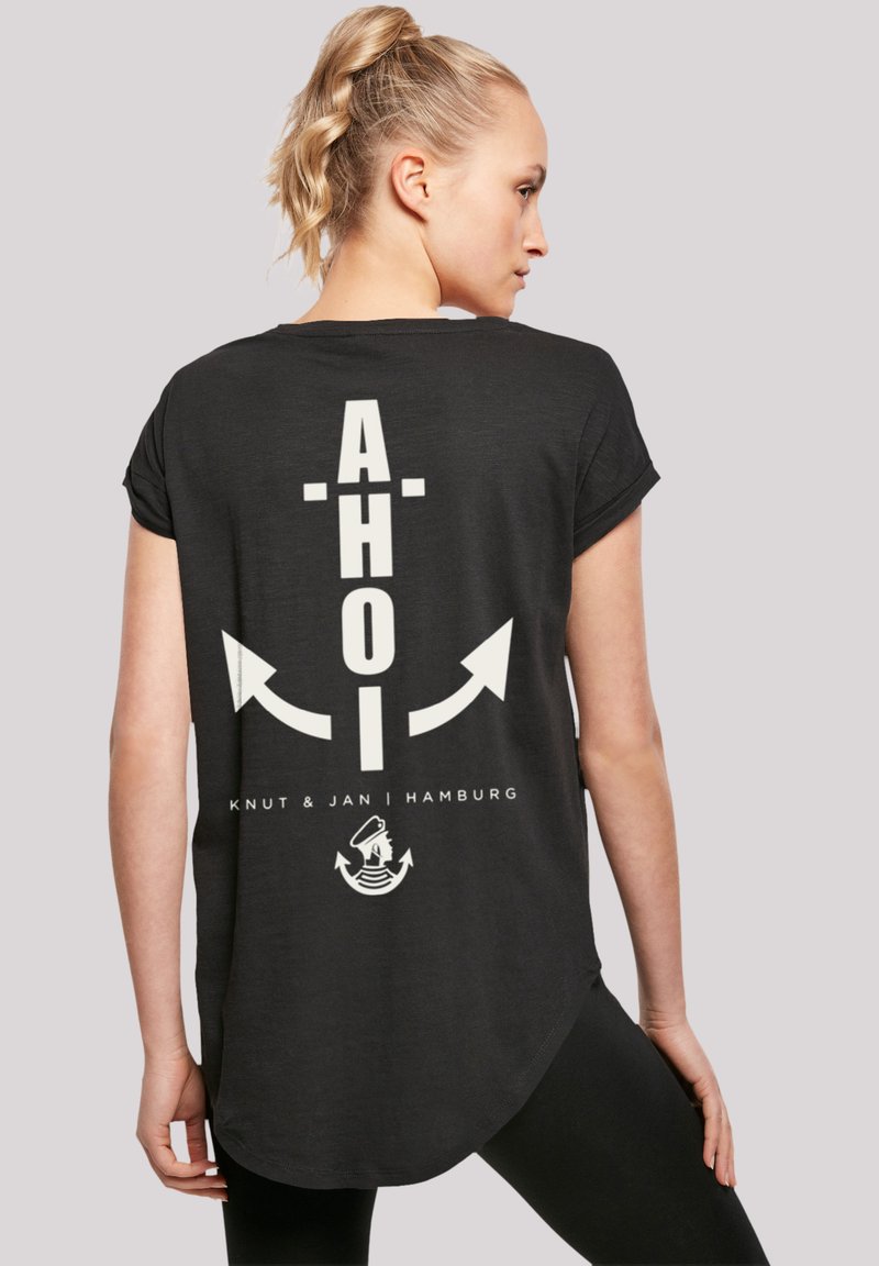 Black short-sleeve t-shirt with a white graphic design featuring the word "AHOI," arrows, and logo details on the back. Textured fabric.