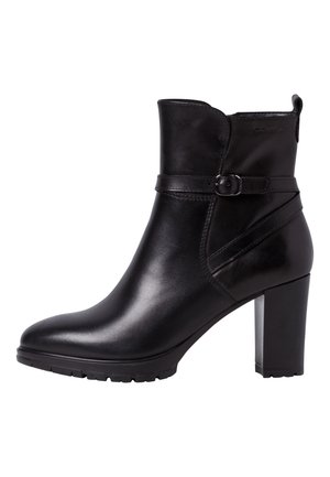 Bottechette en cuir noir, talon bloc haut, bride latérale avec boucle, semelle crantée.