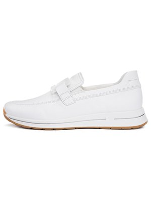 White leather slip-on shoe with a single strap over the instep, cushioned sole, and gum rubber outsole.