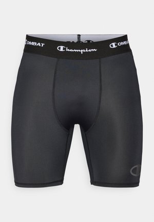 Shorts de compresie atletice negre, confecționate dintr-un material neted, având o talie elastică cu logo imprimat și detalii de cusătură contrastante.